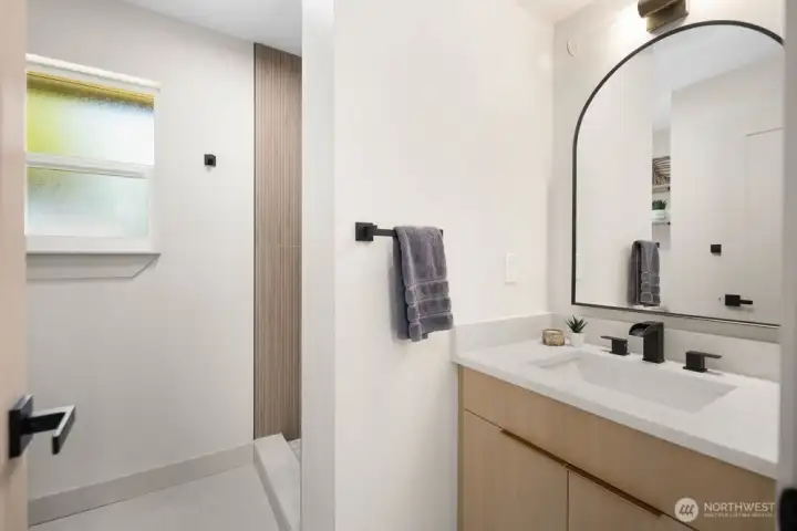 Beautifully updated main bath with light wood