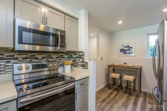 Kitchen with SS Stove, Microwave, Double Door Fridge & Eating area