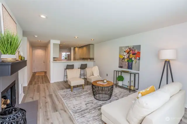 Living area with bar countertop to kitchen