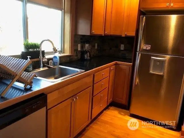 Big windows in your cheery kitchen overlook the brand new community playground (opening 2025)