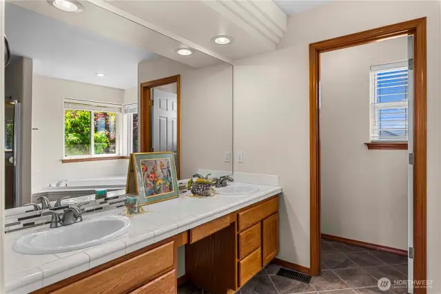 Primary Bedroom with soaking tub and walk in closet.