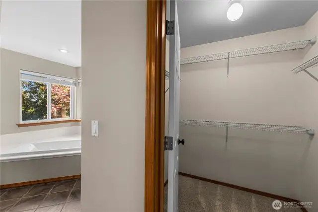 Primary Bedroom with soaking tub and walk in closet.