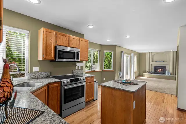 Open kitchen eat in area with access to family room and deck.