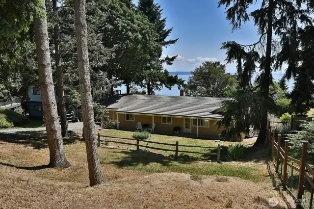 View from the road. One lovely feature of this home is that it has both a front yard and back yard.