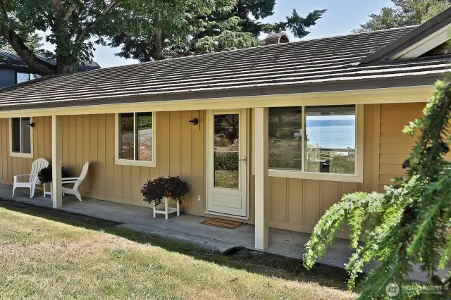 Covered front porch extends the north side of your home and provides a nice place to find shade on hot sunny days. Let's go inside....