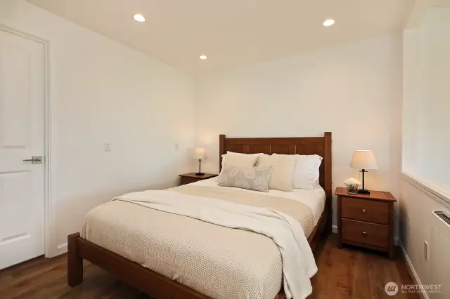 A cozy spot for your bed and also a great spot for a home office. Door to the left edge of this photo goes to a shop space that has a door to the outside/front of the house.