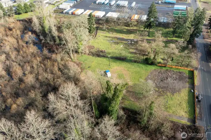 View looking to the east with old torn down duplex that is cleared.  All utilities are on the property already.  Hot property to build 13 townhomes or aparments on soon