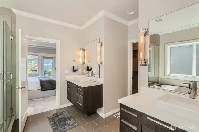 Double vanity en-suite bathroom with large built-in closet.