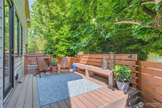 Deck with built-in bench and exterior lighting
