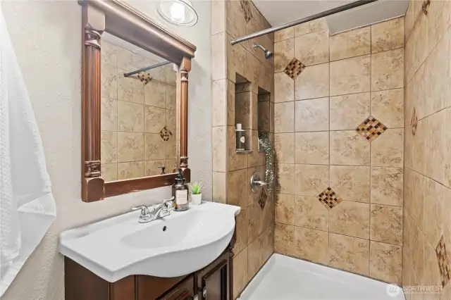 Bathroom for the bedroom wing with a gorgeous tiled shower.