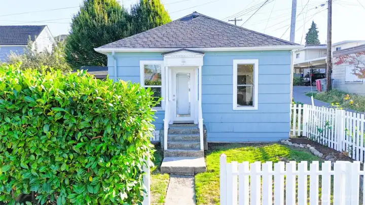 White picket fence in front yard