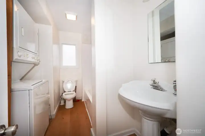 Full Bath with Stacked Washer and Dryer
