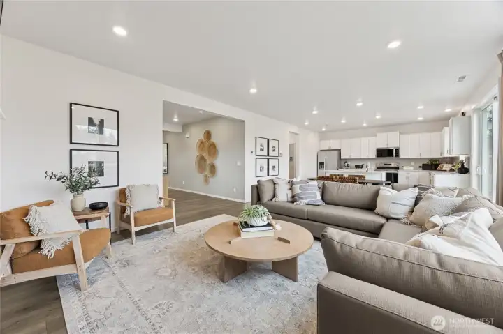 Great room open to kitchen. Perfect for hosting and staying connected to the ones you love.   Pictures are for representational purposes only, colors and features may vary.