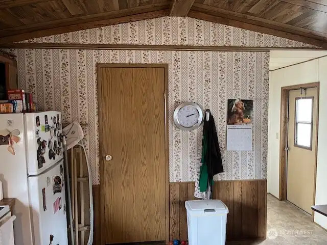 Door to wash/dryer/ht. water heater & storage.