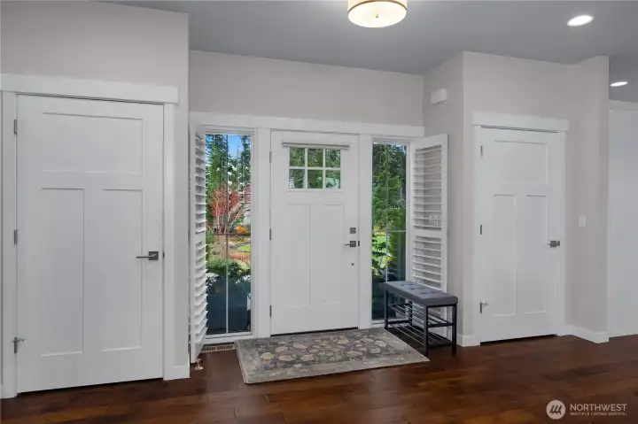 His & hers coat closets.