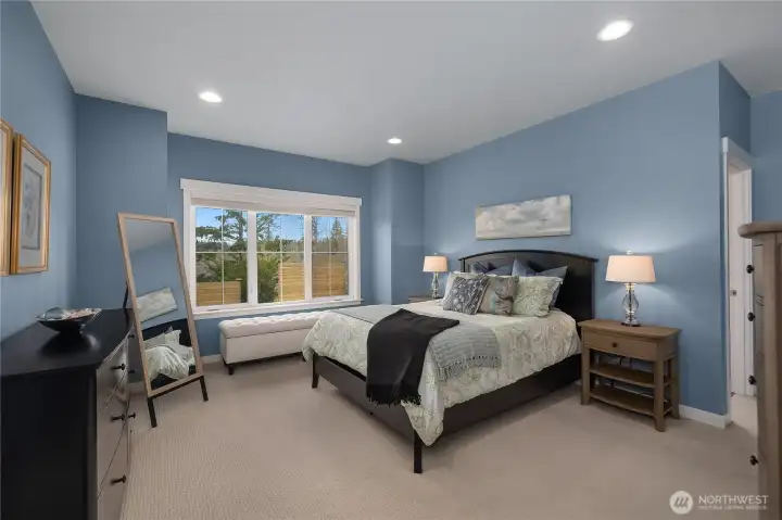 Spacious Primary Suite with can lighting.