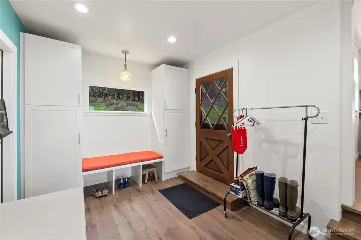 Laundry room flex space with door to the back patio and yard.