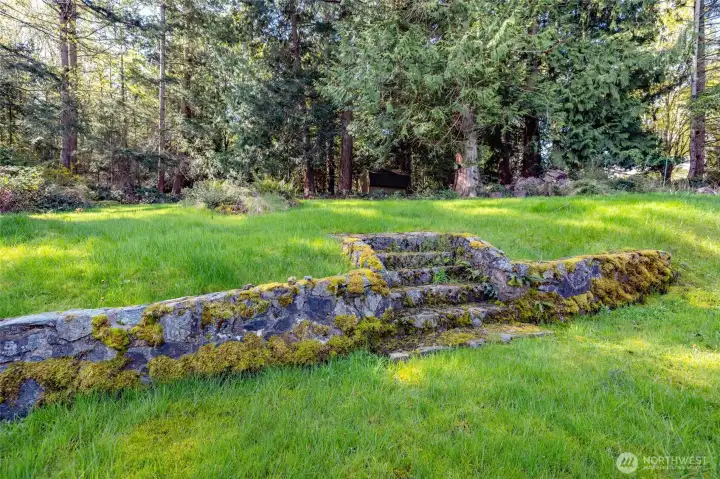 Looking at the backyard and extra lot.