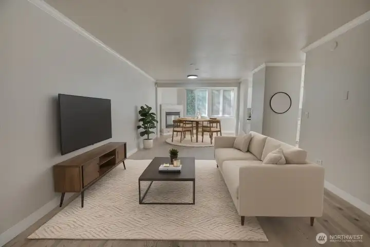 Virtually staged living room to show functionality & division of the open layout. Space for living room set up near front door, and dining set up near fireplace and kitchen entrance at the back of long room.