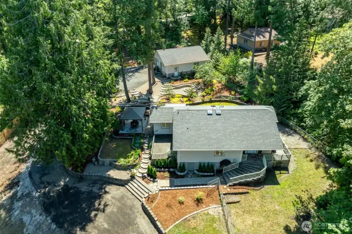 Front of house arial view of property. Front of house arial view of property.