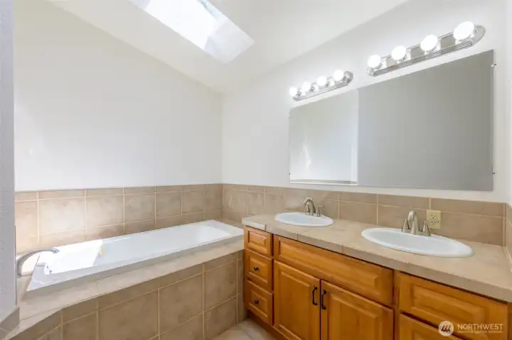 Primary bedroom bathroom. Double vanity, tub, stand up shower. Primary bedroom bathroom. Double vanity, tub, stand up shower.