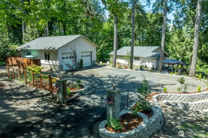 The garage is located just behind the house and has ample parking and turn around space. The garage is located just behind the house and has ample parking and turn around space.