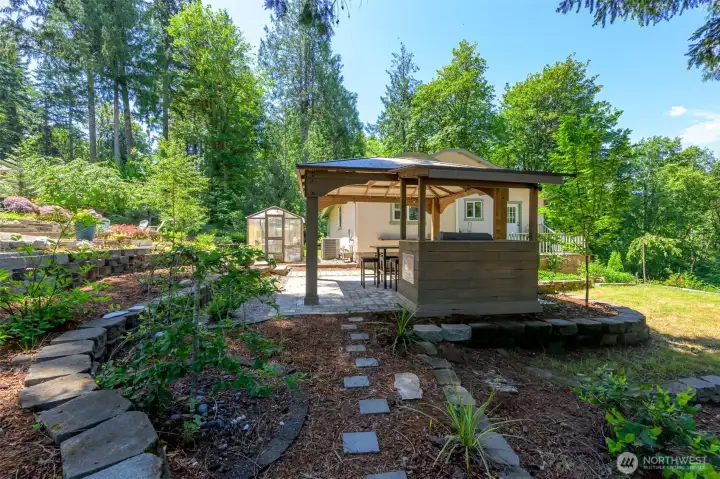 gazebo with covered grilling area. Green house on the back of house. gazebo with covered grilling area. Green house on the back of house.