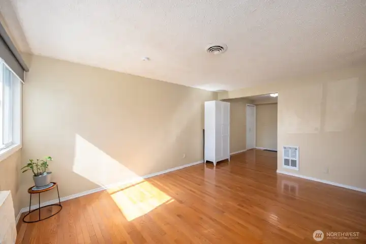 A view from the front door toward the kitchen and laundry room.