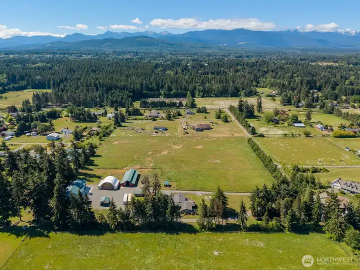 Property is on 2 parcels, each with (apprx) 5-acre hay field/pasture. Fenced and cross fenced. Robin Hill park in background (Pinnell Rd)