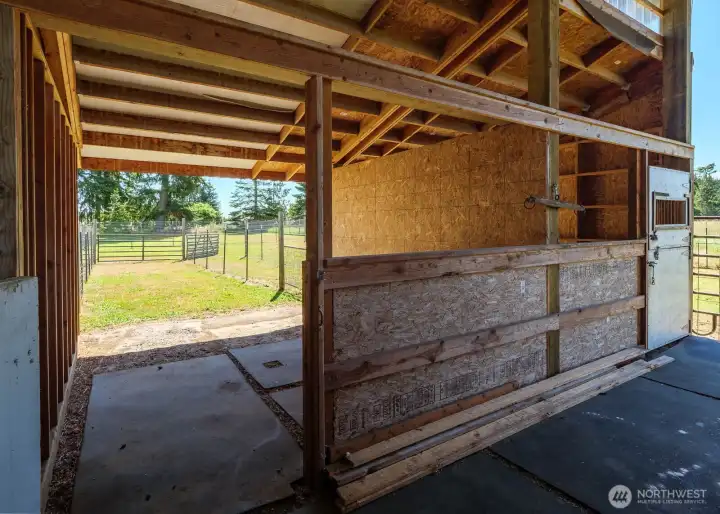 Barn features 8 stalls, fenced pens for each plus open 12X12 space for grooming or wash rack
