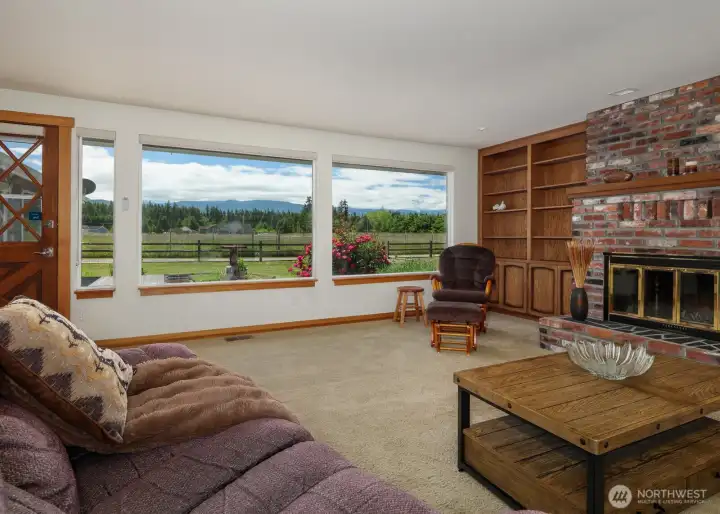 Take in the mountain views! Living room has wood burning FP and built in book shelving