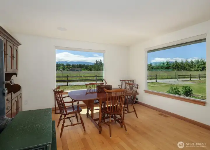 Kitchen eating nook maximizing views of mountains and pastures
