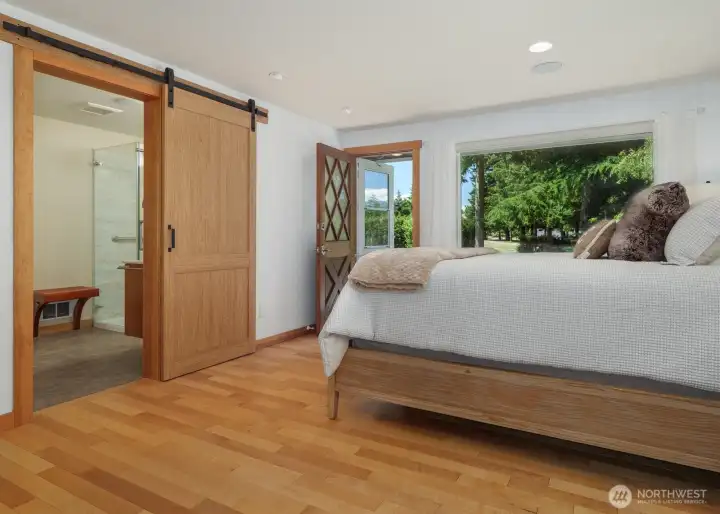 Primary Bedroom & updated Ensuite Bath. Door to private patio.