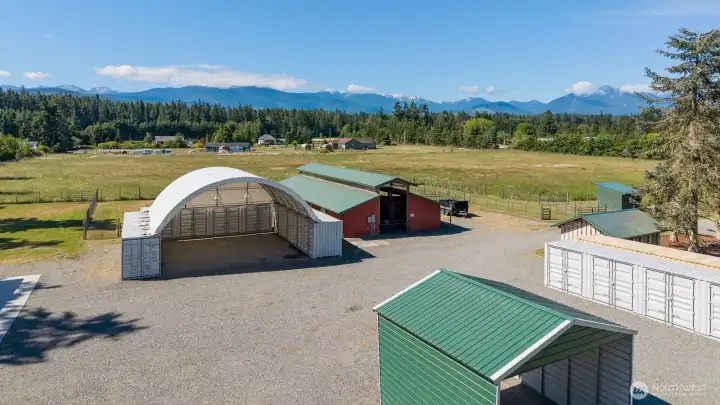 Barn, covered hay storage, RV carport and multiple Conex dry /secured storage containers. Don't forget the views!