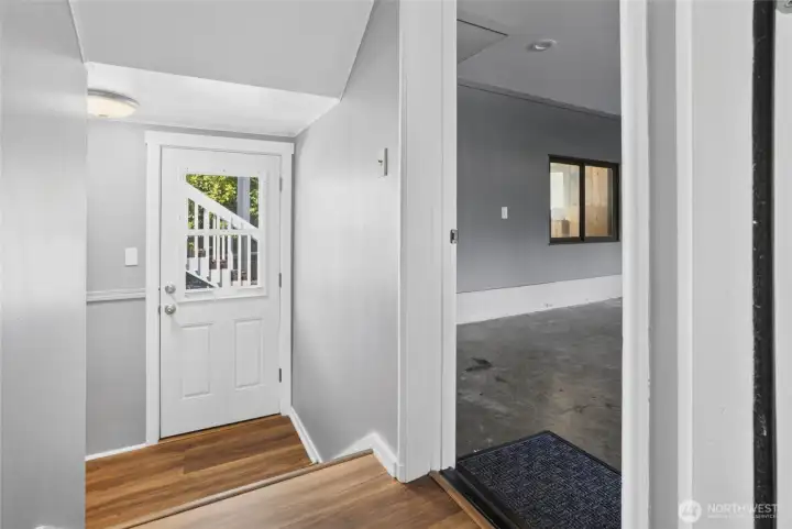 Entrance to garage, exit to patio, and stairway to basement Entrance to garage, exit to patio, and stairway to basement