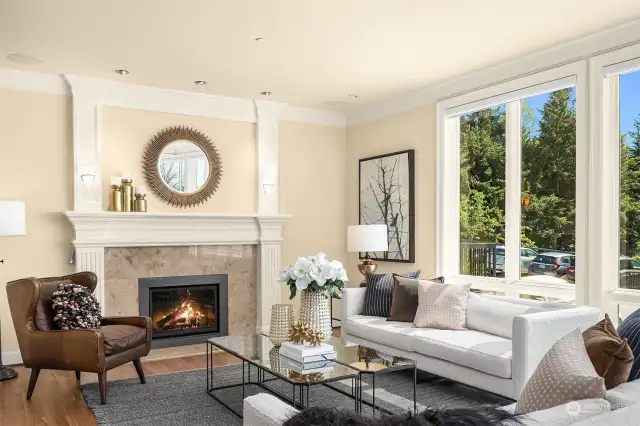 A gas fireplace and sleek moldings complement the formal living room.