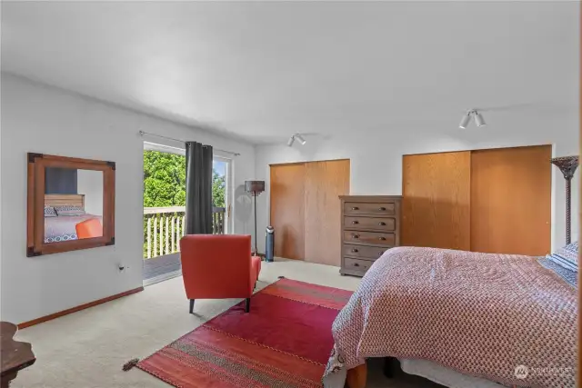 Check out this large primary suite on second floor big enough for all your bedroom furniture and private deck looking out to yard and valley views