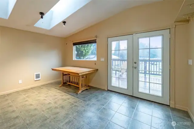 Dining area with french doors leading out to the deck.