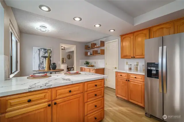 It offers expansive cabinetry plus a pantry (door on the right) for all of your storage needs.