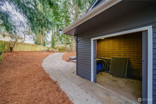 Tucked away on the side of the home, you'll find a spacious storage room—perfect for storing all your gardening tools and outdoor essentials.