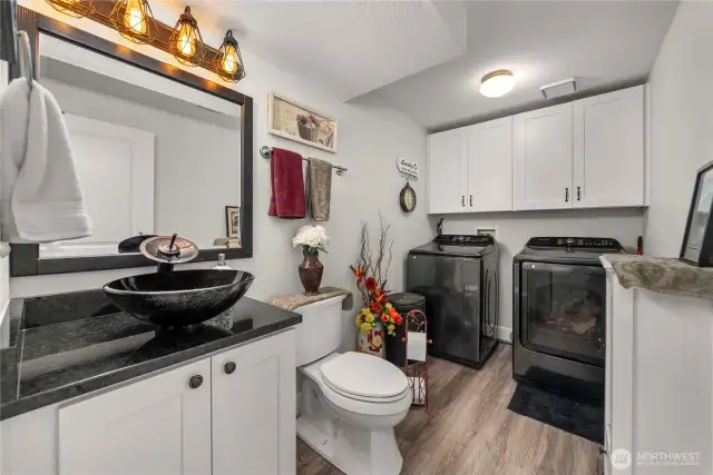 Large utility room on the main floor also with gorgeous flooring and brand new bath.