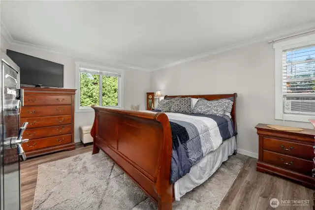 The primary suite is huge and as you can see, gorgeous flooring throughout the home. Wait until you see the sumptuous primary bath.