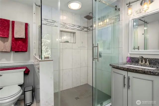 Large walk-in shower in the primary bath with gorgeous tile.