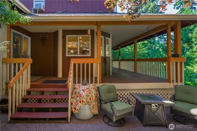 You have multiple outdoor living spaces around the fenced backyard.  This one is perfectly situated near the covered deck, this incredible place is perfect for relaxing or entertaining inside and out.