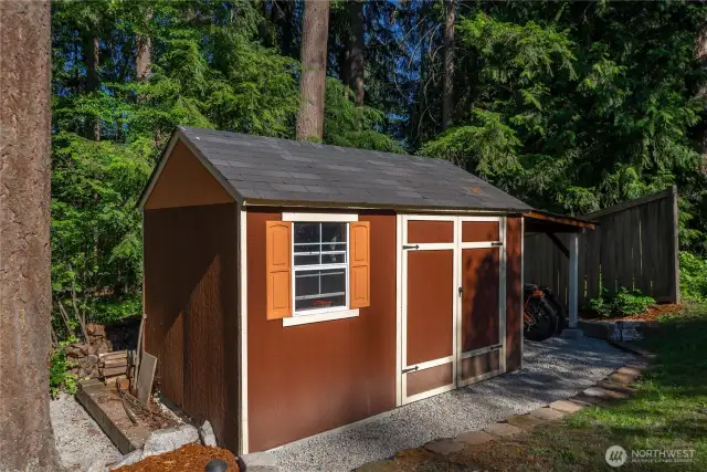 One of two storage sheds and you can see the additional covered space along the far side.