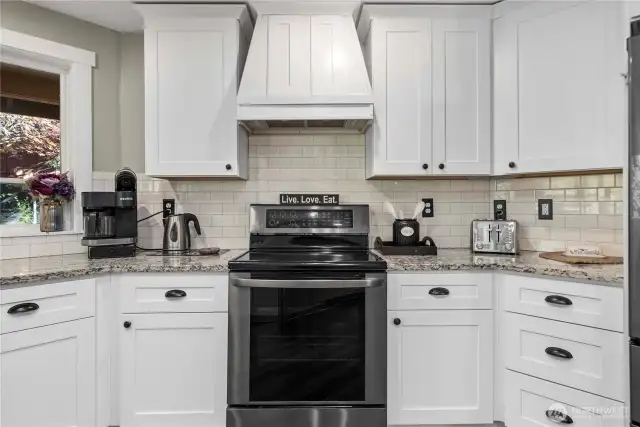 A closer view of the gorgeous kitchen features. Your window looks out over the shaded backyard.