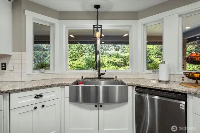 Talk about relaxing while you're in the kitchen, it has a Zen feel to it with french door access to the wrap-around deck just to the left of this photo.