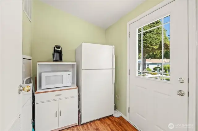 Laundry area right off the kitchen, the freezer, washer & dryer can stay.
