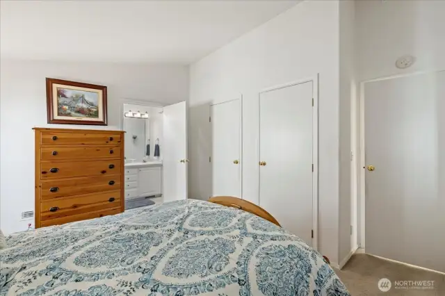 Primary bedroom has two closets, lots of storage.