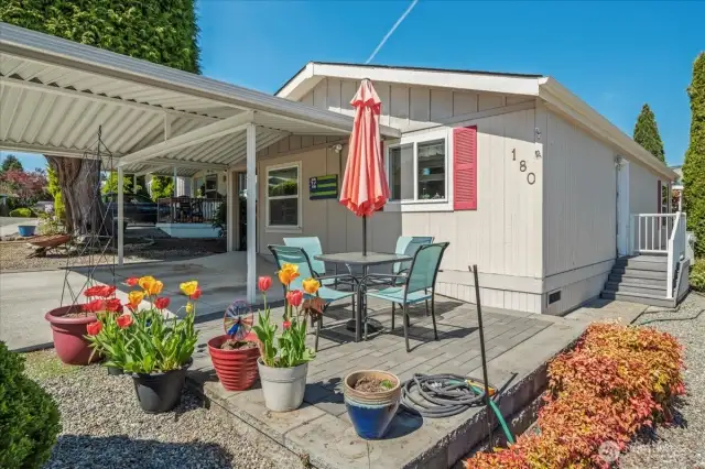Block patio was installed opposite the carport.